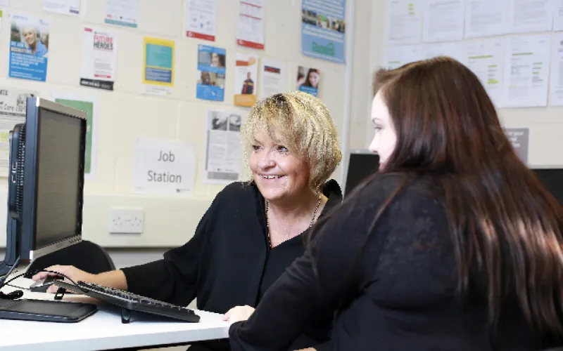 lady at computer being trained