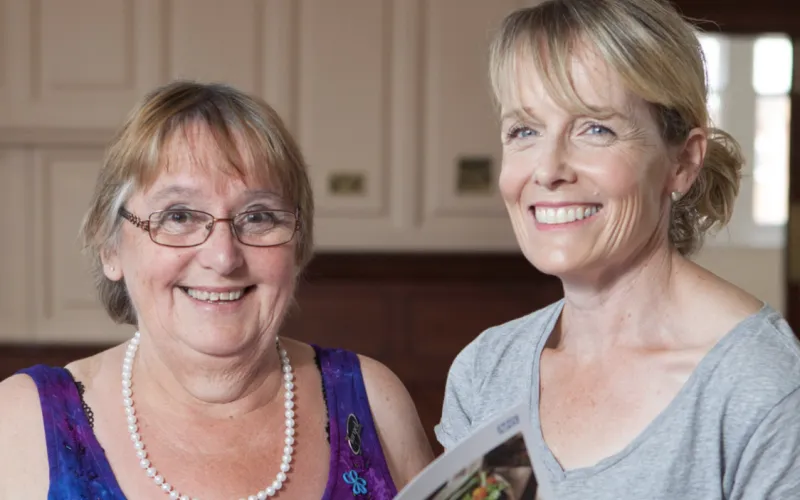 two ladies smiling