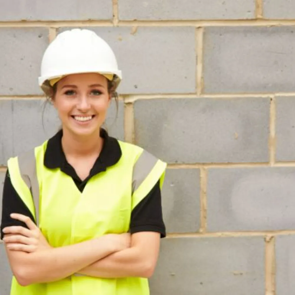 woman with hard hat and high vis
