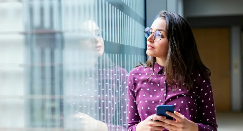 lady looking into window reflection