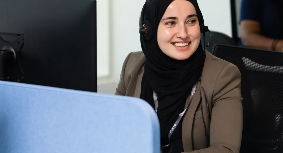 Smiling Call Centre Worker Wearing a Hijab